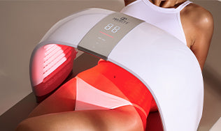 Revitalize your skin: Female treating fine lines with red light therapy.
